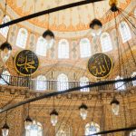 Beautifully ornate interior dome showcasing Islamic art and architecture.